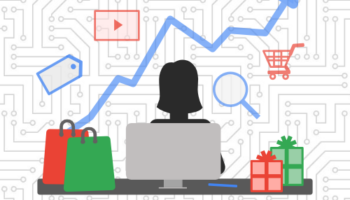 Person using desktop surrounded by presents with a line graph and ppc icons in the background